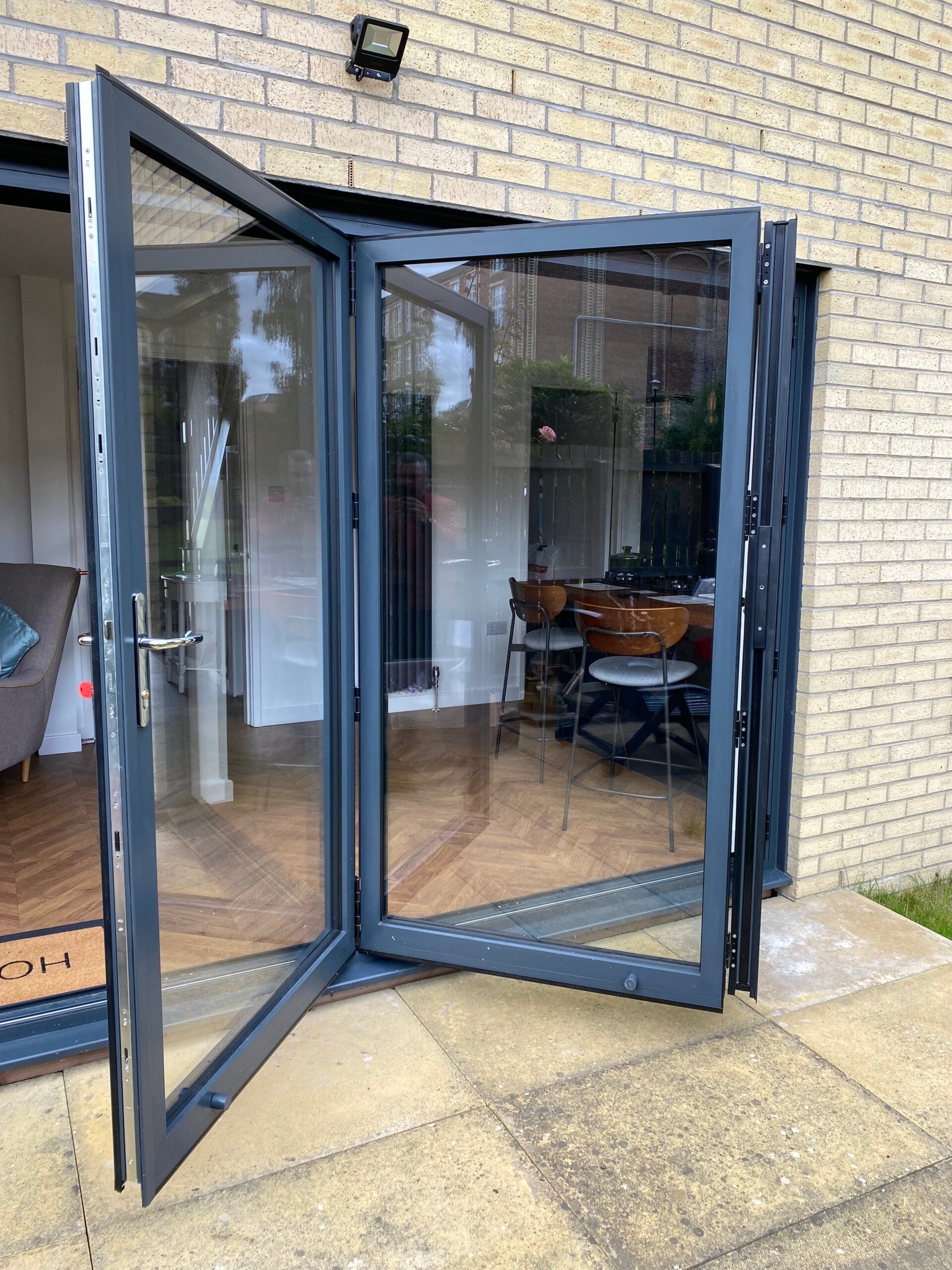 Bifold doors folding open a living space to the garden