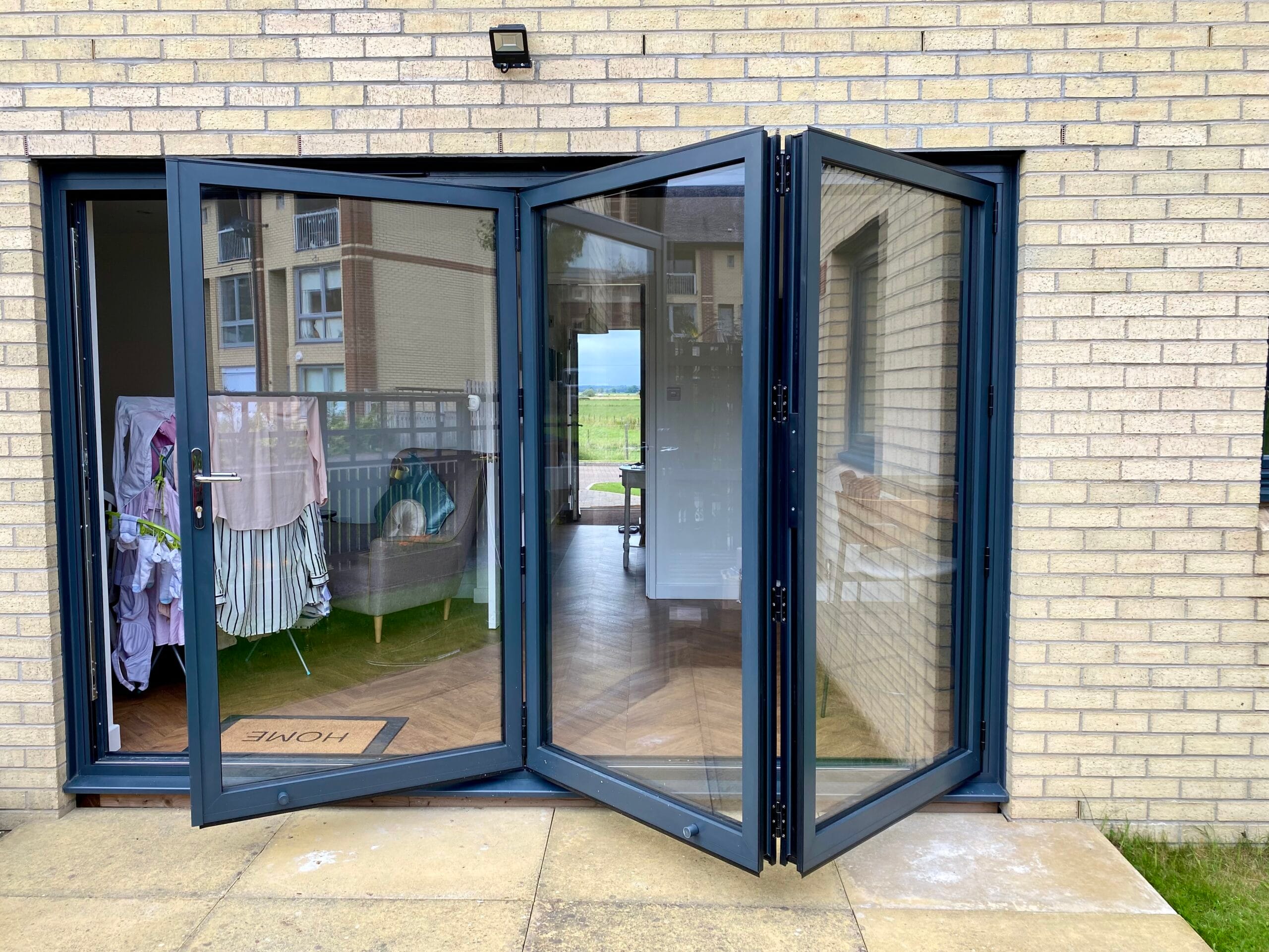 Multi-panel bifold doors folded to one side