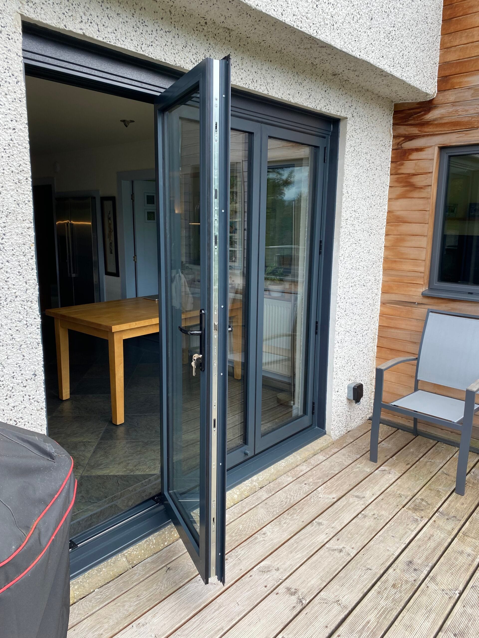 NuView team installing bifold doors in Scotland