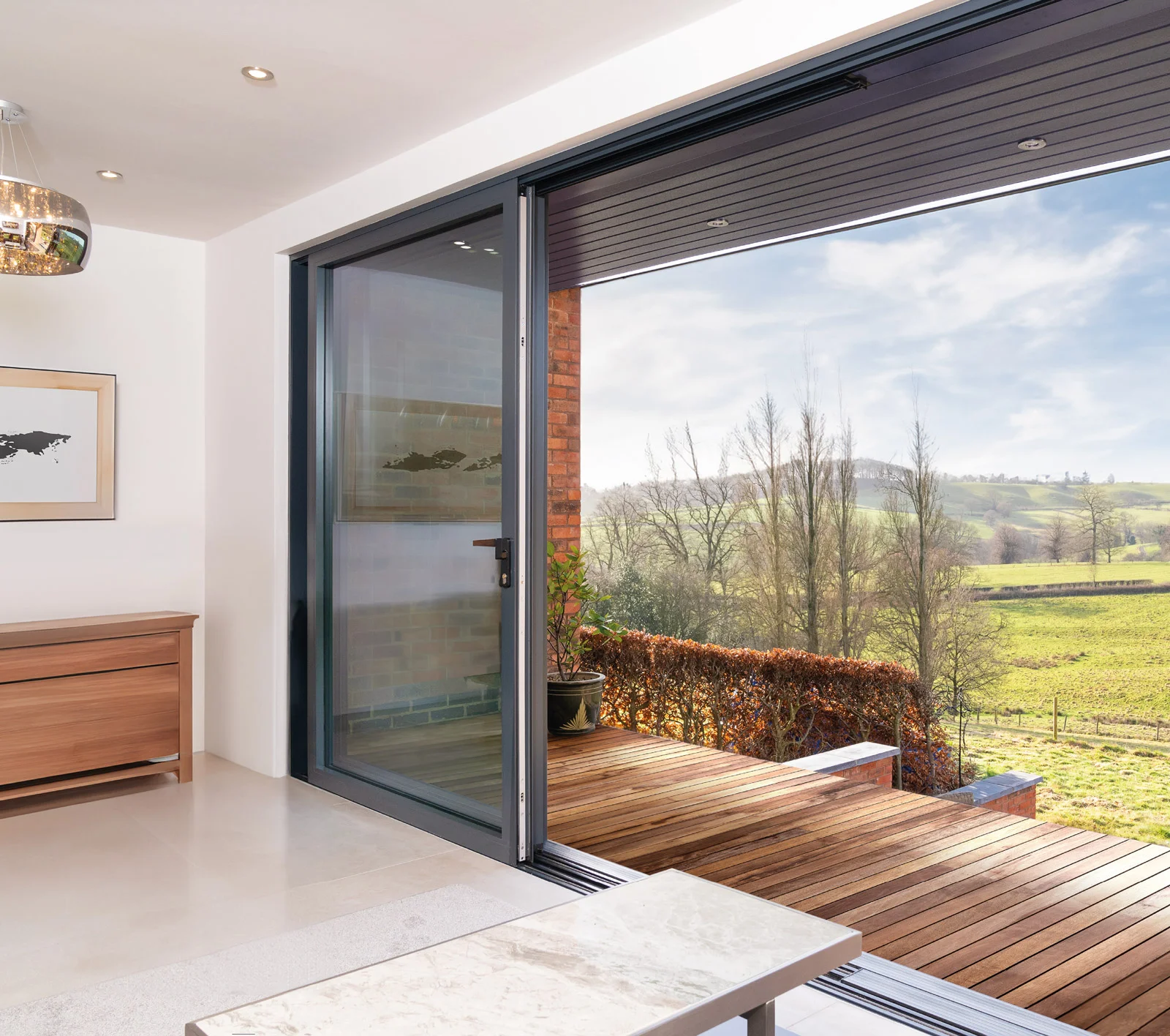 Sheerline aluminium sliding patio doors with a countryside view