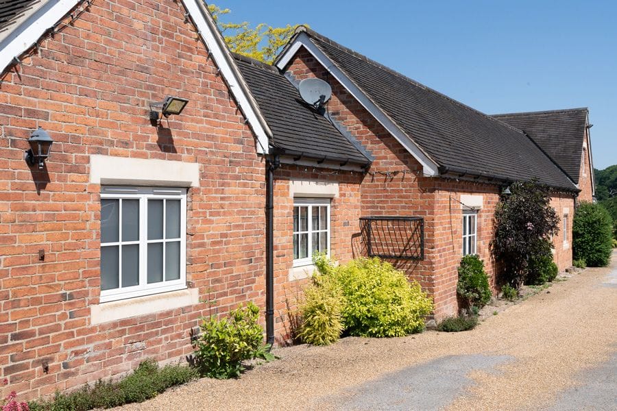 Sheerline Classic stepped aluminium windows on a cottage
