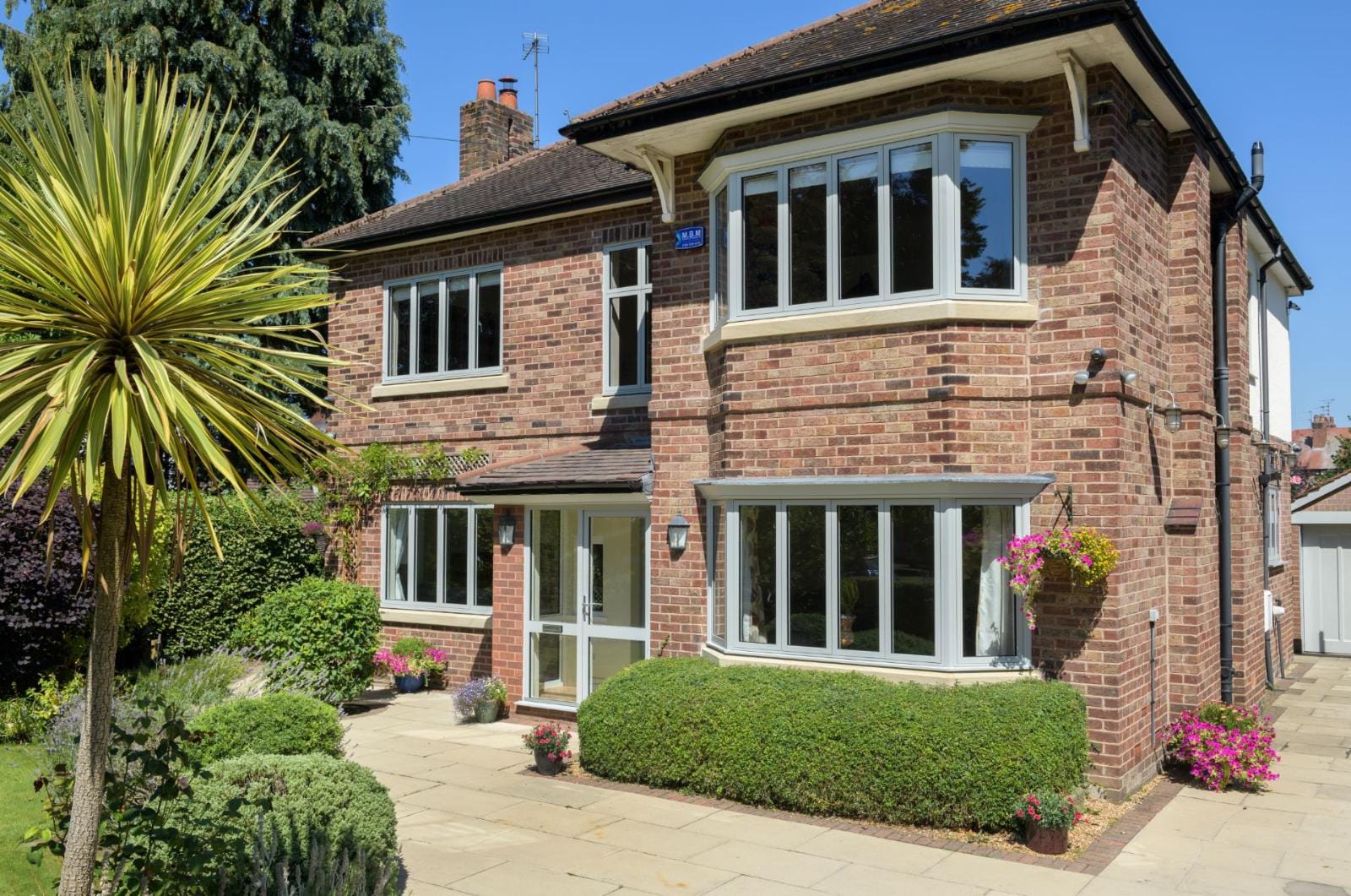 Sheerline Classic aluminium windows on a brick house