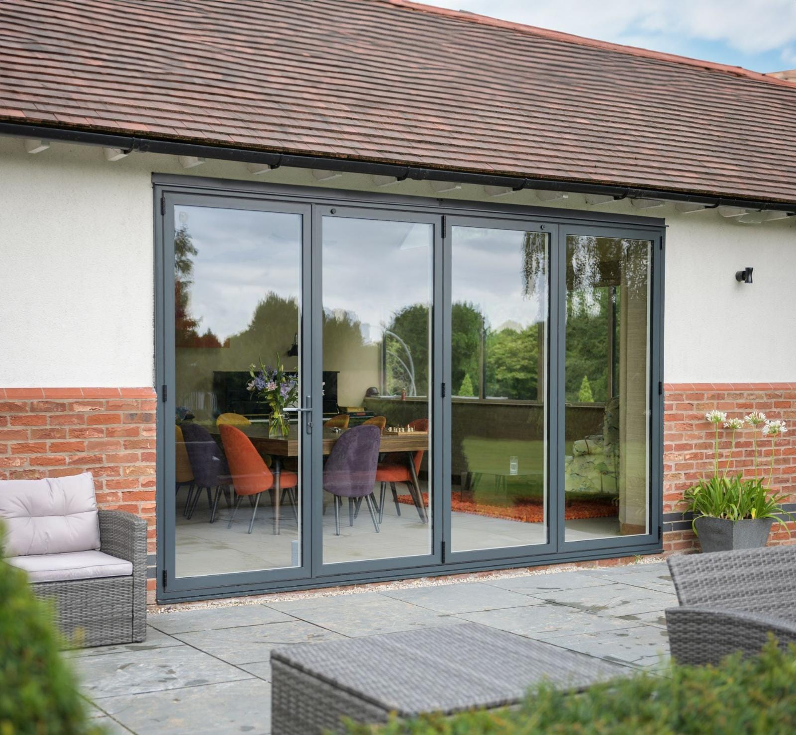 Aluminium bifold doors opening onto a patio