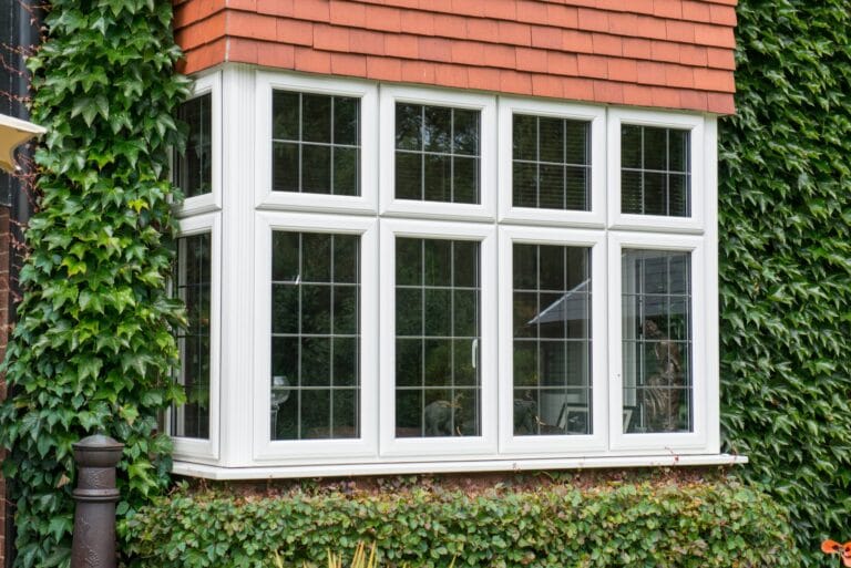 White uPVC bay window on a brick home