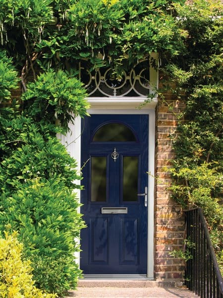 Steel blue uPVC front door on a brick-built home