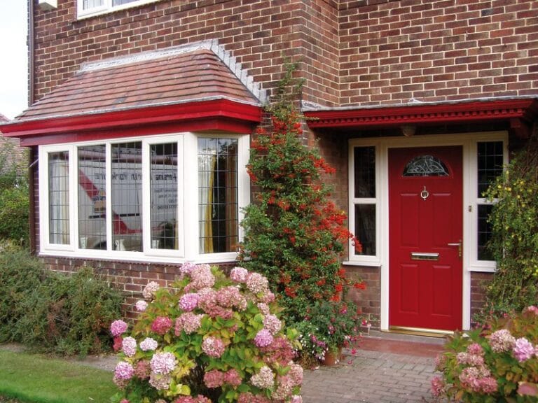 Red uPVC front door on a traditional home