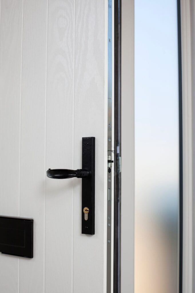 White uPVC front door seen from inside the home
