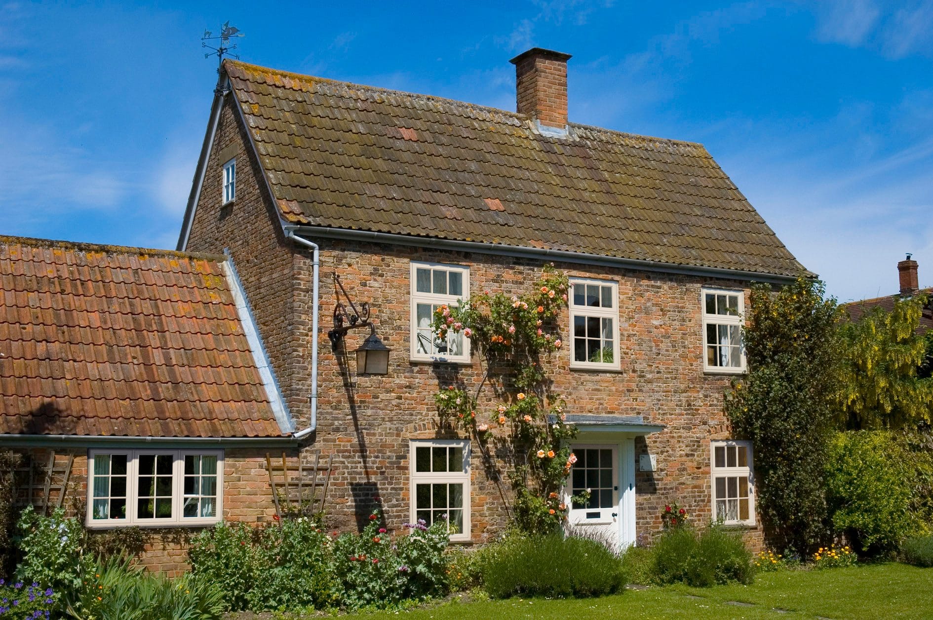 Cream flush sash window - fitted on a home exterior