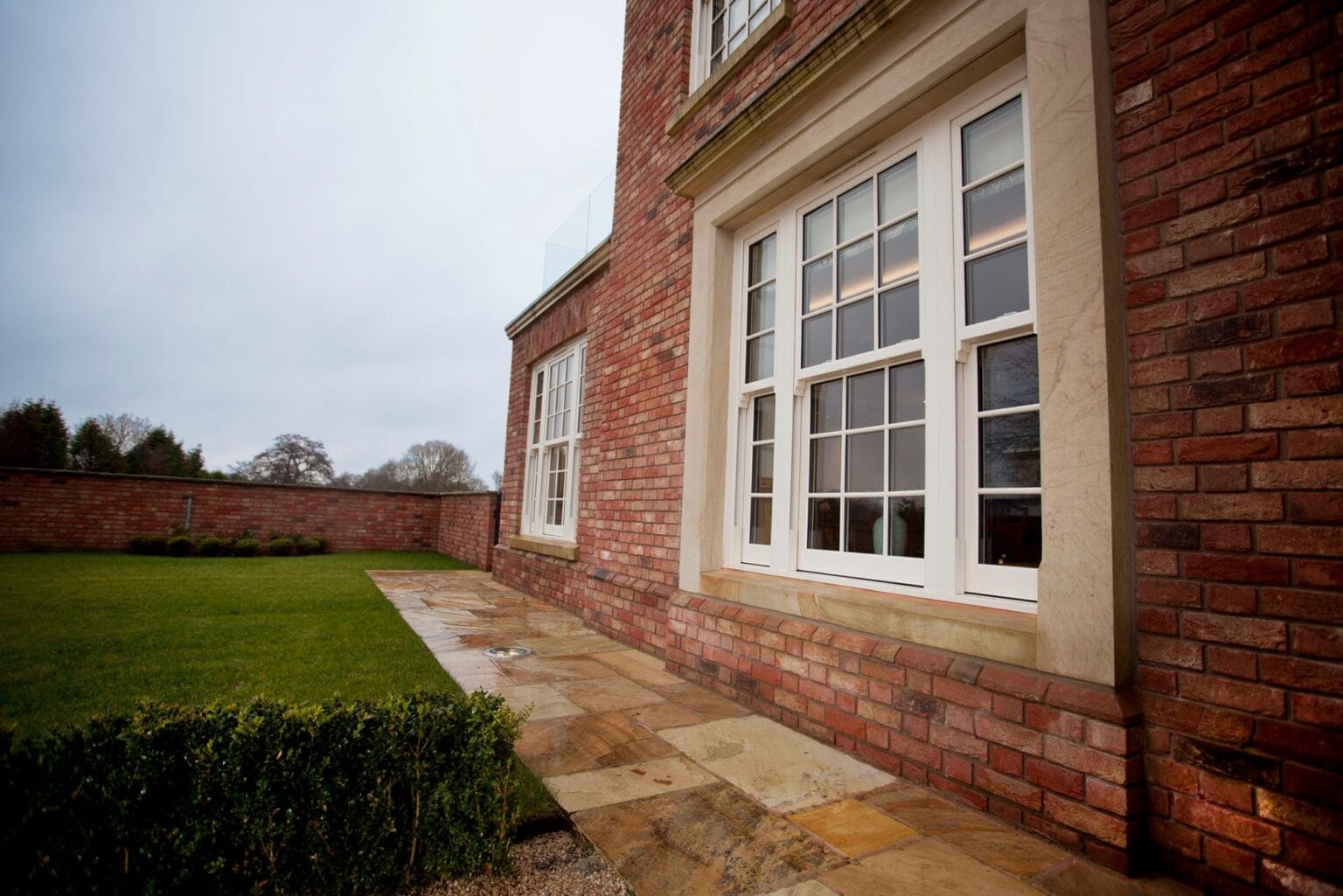 Sash-style uPVC window fitted in a sandstone building