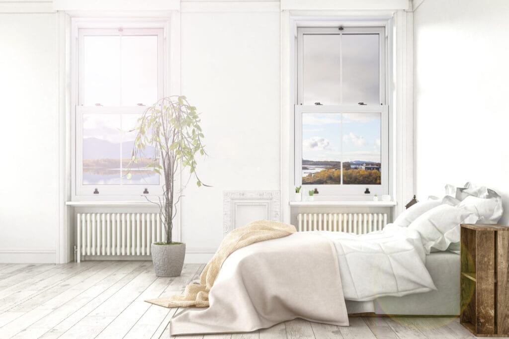 White vertical sliding sash window seen from inside a bedroom