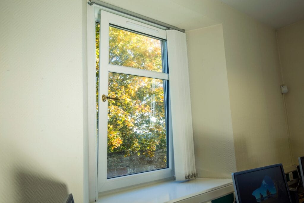 White uPVC tilt and turn window seen from inside the home